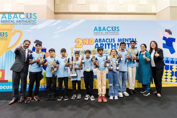 CMA India students lined up with their trophies in Singapore