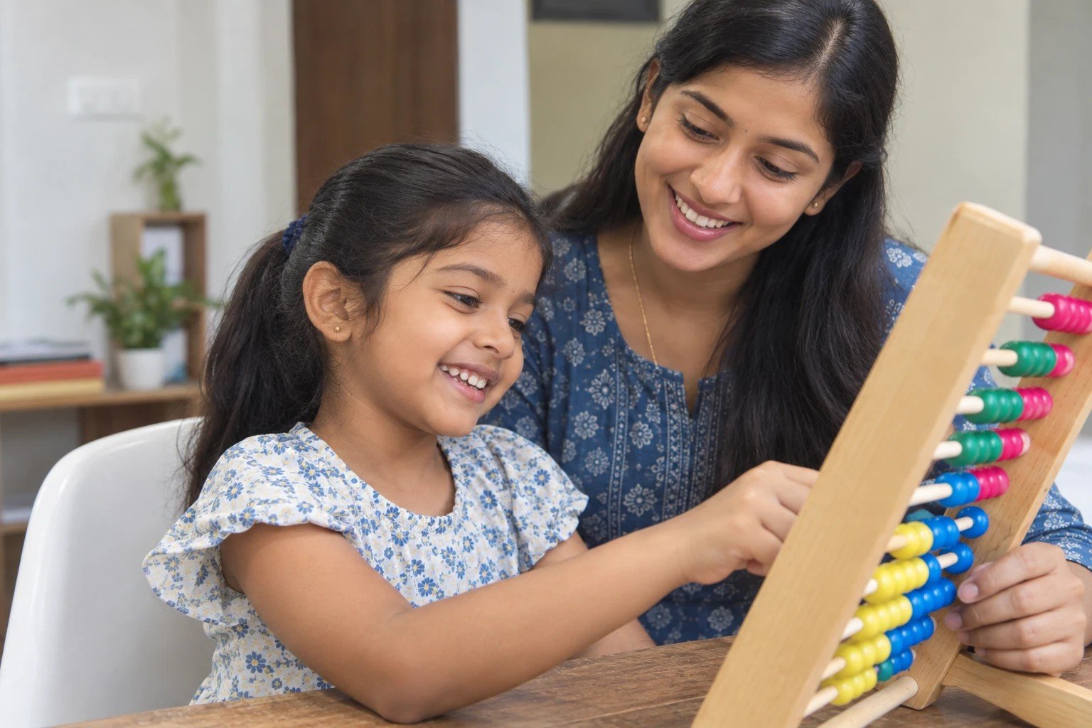 A smiling girl learning on an abacus with her mother