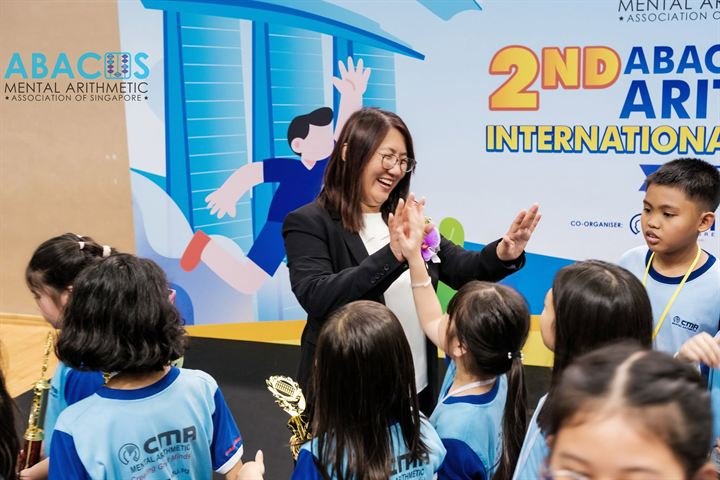 Young CMA students giving a high five